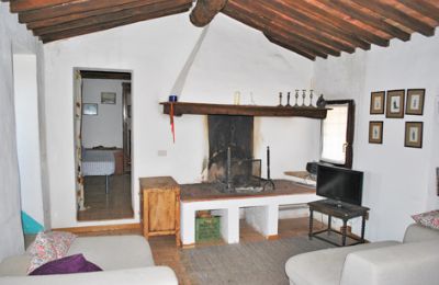 Bauernhaus kaufen Siena, Toskana, RIF 3071 Wohnraum mit Kamin